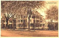 41 Elm Street, Northampton, MA. 1900 photo shows addition of Victorian-era porches. Originally built c. 1810. Federal style.[9]
