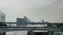 The tower is seen from the place of former Ba Son Shipyard, now is Ba Son Complex and Ba Son station, on a train of HCMC Metro Line 1 in 2025