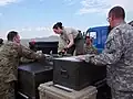 Alaska Air National Guard members loading cargo pallets at Chinggis Khaan International Airport during Khaan Quest 2018