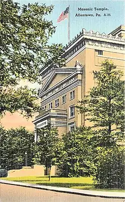 Large building surrounded by trees