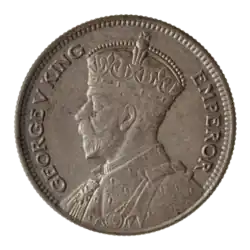 A coin featuring a crowned bust of King George V