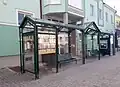 A bus stop in the town.