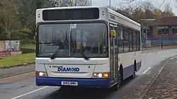 A Diamond Bus on Hawbush Road with the Northern entry to Hawbush School in the background