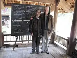 A picture of Michel Ferlus with Vi Khăm Mun, a scholar of Tương Dương, Nghệ An, Vietnam, at Mr. Mun's home