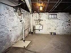 a photo of the signature mural in the Albert Watkins house basement.