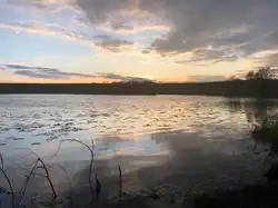 A photo of Auchencrieff Loch during a sunset.