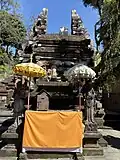 Candi bentar (spilt gateway) and an anltar with linga and yoni