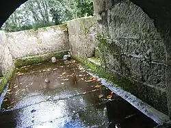 The main bathing pool, viewed from under the wellhouse