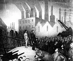 A black-and-white film still. A nude woman stands atop a hill surrounded by factory workers, with factories in the background.