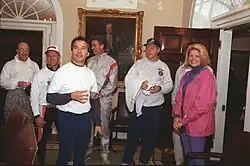 A small group of people with Bill Clinton