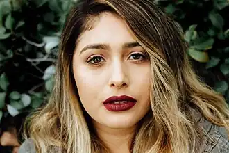 Woman wearing Instagram-influenced bold lipstick and contour makeup popular in the mid to late-2010s, 2017.