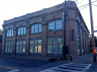 Image of a two-story brown brick square building