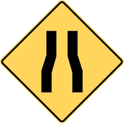 Road narrows.