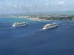 Two cruise ships, Freedom of the Seas and Carnival Venezia anchored at Grand Cayman on 24 April 2025