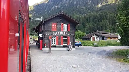 Two-story wooden building with gabled roof