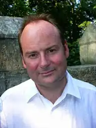 A man in a white shirt