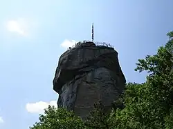Chimney Rock, a 315-foot (96 m) gneiss monolith in Chimney Rock State Park near the village (2006).