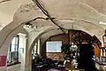 Former café space, with the preserved barrel vault visible in the room