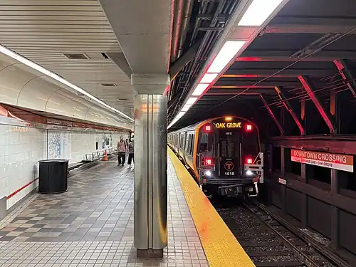 A metro train at an underground platform