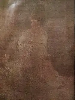 A deity in three-quarter view dressed in a robe.