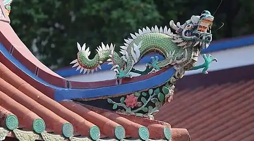 A colourful ceramic dragon figure on the rooftop corner of the Guanyin Temple.