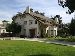 Side view showing two floors plus an attic