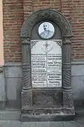 Memorial to the church benefactor near the entrance
