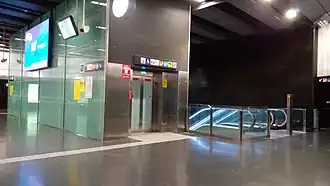 Escalators connecting the station hall to the Line 9 and Line 10 platforms
