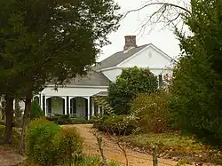 A portion of the front elevation of the Greek Revival main house in 2008