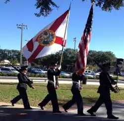 The state flag being carried by Florida National Guard