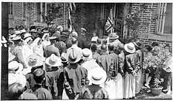 This is a picture of Governor Tang Jiyao arriving at opening of Hui Tien hospital. H. Gordon Thompson's daughter, Greta, aged 4, presenting the key to the hospital