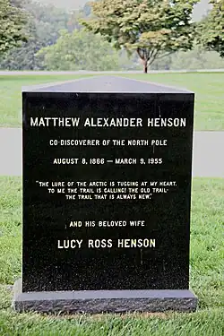 Tombstone with the words "Matthew Alexander Henson/Co-Discoverer of the North Pole/August 8, 1866–March 9, 1955/"The Lure of the Arctic is Tugging at my Heart; To Me the Trail is Calling, The Old Trail, The Trail that is Always New"/and his beloved wife/Lucy Ross Henson"