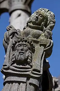 St Veronica holds up her veil bearing Jesus' image.