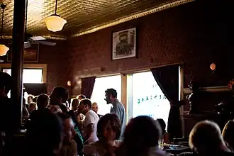 The Homestead has restored period details, like velvet flocked wallpaper and stamped metal ceiling tiles (in 2009)