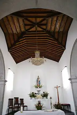 The wood vaulted ceiling in the apse