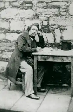 James Brown sat at a desk in his cell at Castle Rushen Gaol