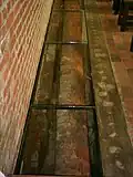 Foundations of the older churches, seen through glass in the floor
