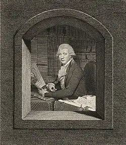 Seated engraved portrait at a library of John Thane, examining a print, a pile of manuscripts with seals to his left