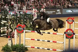 John Whitaker and Argento jumping at Olympia 2017