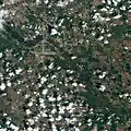 Natural-colour satellite image of Minot taken just as the River Souris reached its historic crest.