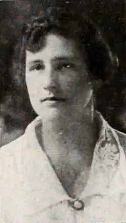 A young white woman with wavy dark hair