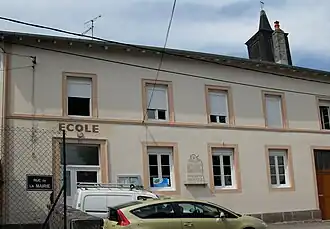 The town hall and school in Le Roulier