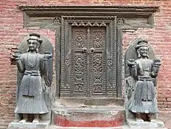 Sculpture of Jagata Prakasha Malla and his minister Chandrasekhara at the royal palace of Bhaktapur.