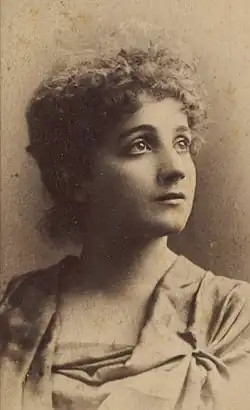 Bust-length photographic portrait, looking up to her left, of Edith Morgan Gellibrand