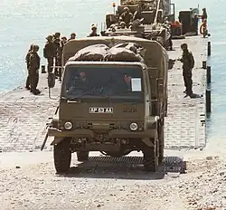 British Army Leyland 4-tonne general service (GS) truck leaving a Mexefloat pontoon.