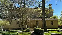 One-story shed on rear of the house