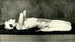 In Supta Virasana, demonstrating "A good exercise for the back and abdominal muscles". Photograph by John de Mirjian, c. 1928