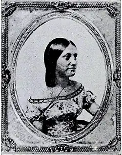 Black and white profile photograph of a 19th-century woman in Western dress