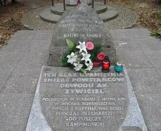 Boulder and plaque at 15 Grotowska Street in Boernerowo commemorating Home Army soldiers killed on 2 August 1944
