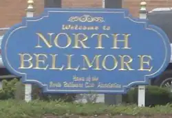 A welcome sign near an entrance to the hamlet.